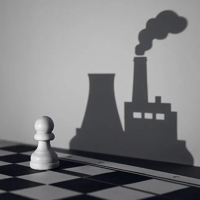 Concept de stratégie industrielle de réduction des émissions avec silhouette d’usine et traitement des fumées